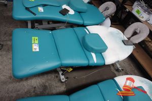 31 · 1 X ATHLEGEN ELECTRIC TREATMENT TABLE, APPROX; 1.7M L X 660MM W X 670MM H , DAMAGED BACK REST AND TORN FABRIC, UNTESTED (SOME MARKS)