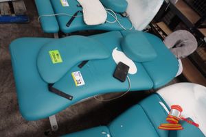 32 · 1 X ATHLEGEN ELECTRIC TREATMENT TABLE, APPROX; 1.7M L X 660MM W X 670MM H , TORN FABRIC, UNTESTED (SOME MARKS)