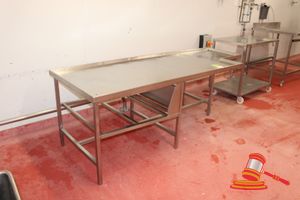 19 · HD STAINLESS STEEL WORK/PROCESSING TABLE WITH DRAINAGE HOLES. TILTABLE TABLE TOP. CUTOUT SECTION AT ONE END. APPROX 2440 X 900 X 830MM