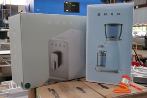 27 · 1 X SMEG BEAN TO CUP COFFEE MACHINE, MODEL: BCC13EGMAU, 220-240V 50-60HZ 1235-1470W, GROSS WEIGHT: 11.7KG, UNTESTED (BOXED), 1 X SMEG COFFEE GRINDER, MODEL: CGF11PGAU, 220-240V 50-60HZ 150W, GROSS WEIGHT: 4.78KG, UNTESTED (BOXED)