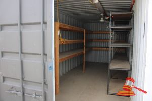 9 · 20FT Container, Fork Pockets, Plywood Floor, DOM: 2004, Serial: ECMU167732, with Ceiling Lights, Fan, Custom Timber Shelving, and 3 x Adjustable Metal Racks, Approx Each: 1200mm x 540mm x 2100mm - affixed to Wall