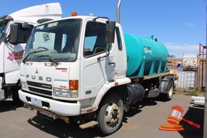 1 · 2007 Daimler Chrysler Fuso FM600 Water Tank Truck, White, 4 x 2, Manual, Diesel Reg #: Unlicensed ODO: 34,761 Kms Showing on Clock VIN: JLFFM61FH0KK00066 Features: Power Steering, 6 Speed, Poly Water Tank 7000L, Electric Start Diesel Pump, Model 188FV, Displacement 47L/CC, With Front/Rear Spray Bars, Hose Reel, In Cabin Spray Bar Controls, Spare Tyre, Beacon, Spray Hours - 1,463 Hrs Showing. (*Key # 1, S#861*) Condition: **Flat Batteries - Jump Start Required, Surface Rust To Chassis & Spray Equ