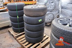 62 · 5 X BRIDGESTONE DUELER A/T, 265/55R20, 113V, WITH SILVER RIMS, 6 HOLE, SOME MISSING CENTRAL HUB CAP, POSS OTHERS, ON A PALLET
