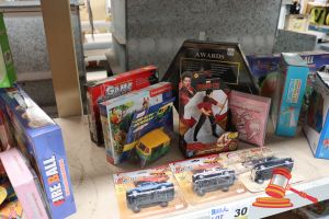 Bundle Of Toys Including: 1x Shang-Chi Action Figure, 1x Abalone Game, 1x Game Super, 4x Assorted Centy Cars, 1x Killer Bunnies Booster Decks, 1x Castorland Puzzles, All Unopened