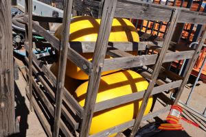174 · 3 X YELLOW BOUYS WITH HOOK ATTACHMENT, APPROX; 800MM L X 410MM D, SOME MARKS, IN A WOODEN CRATE,