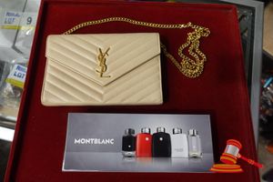 1 X YVES SAINT LAURENT CLUTCH BAG ON CHAIN, BEIGE QUILTED LEATHER, GOLD HARDWARE (SOME MARKS) AUTHENTICITY UNVERIFIED. 1 X MONTBLANC FRAGRANCE GIFT SET, INCLUDES: 5 X MINIATURE BOTTLES, POSS UNUSED (BOXED)