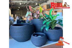 Matching set of 2 Mediterranean Black Planters - Sizes: 39 x 51 cm, 28 x 37 cm, RRP $230 Create a stylish designer display from the RippleLite Tower range, featuring a tall sculptural planter with a subtle horizontal ribbed finish, this range brings a clean, contemporary look to homes, patios, courtyards, entryways and landscaped spaces. Constructed from super-light resin blend, it combines practical lightweight handling with a premium look. It is designed for indoor and outdoor use, UV resistan