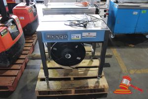 14 · 2022 SEMI AUTOMATIC STRAPPING MACHINE, MODEL: EXS-303, SN:S2205C737. 220V 1PH 0.2KW.MOBILE. SOME CORROSION MARKS ON TABLE TOP. TOTAL DIMENSIONS APPROX 800 X 600 X H800MM (UNTESTED)