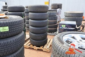 55 · 6 X DUNLOP GRANDTREK AT30, 265/65R18 114V, WITH GREY RIMS, MISSING CENTRE HUB CAP, 6 HOLE, POSS OTHERS ON A PALLET