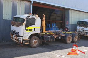 2017 Isuzu FVZ300 Hook Bin Truck White, 4 x 2, Auto, Diesel, Reg #: Unlicensed ODO: 85,417 Kms Showing On Clock VIN: JALFVZ34SG7000145 Features: Air Conditioning, Power Steering, Wire Mesh Screen Protector, Exterior Sunshade, LED Lights, Fire Extinguisher, Palfinger Heavy Duty Hook Loader. (Asset # NBG-TRK-438), (Disp# 04.26.2026-15:42:08), (*Key # 233, WP # 4760*) Condition: **Rust Across Vehicle.** Panel: FAIR, Paint: FAIR, Glass: FAIR, Tyres: FAIR Dash: FAIR, Upholstery: FAIR, Floor: FAIR, Ov