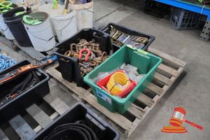 Assorted Rigging Equipment, Includes: 1 X Tub Of Assorted Shackles (Various Sizes, Yellow/Red Painted), 1 X Tub Of Assorted Shackles And Hardware, Coiled Yellow Tubing, 1 X Tub Of Blue Ratchet Straps, On A Pallet