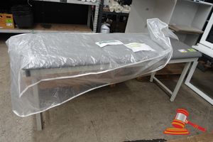 64 · 1 X GREY VINYL EXAMINATION / TREATMENT TABLE WITH ADJUSTABLE BACKREST, WHITE POWDER COATED FRAME, WITH PLASTIC BAG/COVER, APPROX L1950mm x W720mm x H800mm (POSS UNUSED)