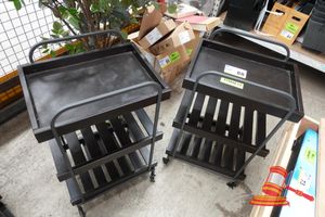 2 X MOBILE SALON TROLLEYS, BLACK METAL, MULTI-TIER WITH SLATTED SHELVES, ON CASTERS, APPROX; 480MM D X 360MM W X 770MM H, SOME MARKS