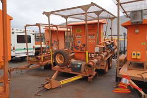 11 · 2015 UON DEWATERING TRAILER TANDEM, ORANGE, SWITCH CONTROL PANEL CABINET, SERIAL# 4572-01, RING HITCH, SECTION OF PIPING AND VALVES, BORE PUMP STARTER PANEL, ASSET# TA1041
