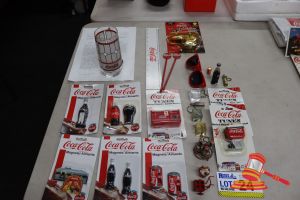 24 · LOT OF COCA-COLA COLLECTABLES, INCLUDES: MAGNETS (VARIOUS DESIGNS INCLUDING BOTTLES, CANS, DINER), MUSICAL MAGNETS, MINI EXTREME SKATEBOARD (FANTA BRANDED), RED SUNGLASSES, COCA-COLA RULER, DRINK STIRRERS, MINIATURE BOTTLE KEYCHAINS, DECORATIVE GLASS WITH