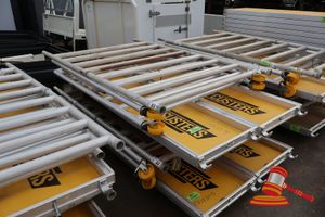 2 X Aluminium Framed Platforms, Approx; 600mm W X 2.4m L X 60mm, 3 X Metal Frame Sides, Approx; 1.3 M W X 2.9 M H, 1 X Metal Framed Approx; 1.1 M H X 1.3 M W, Some Marks, On A Pallet