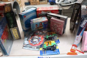 14 · BUNDLE OF TOYS INCLUDING: 1x MAGNETIC COMPASS, 2x GAME SUPER, 2x CASTORLAND PUZZLES, 1x KILLER BUNNIES BOOSTER DECK, 2x CENTY CARS, 1x YO-YO, 1x POOL COVER, COSTUME HANDCUFFS, ALL UNOPENED