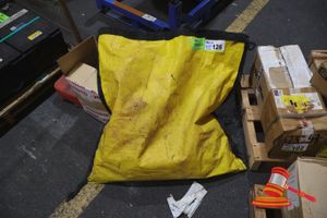 Spill Kit Bag That Contains Several Snake Bunds And Disposable Waste Bags With Some Gloves.