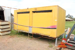 TRUCK BODY ENCLOSURE WITH 4 X ROLLER DOORS ON TRAILER FRAME. YELLOW. CAN BE SEPERATED.1 X ROLLER DOOR DAMAGED. APPROX 4000 X 2000 X H1800MM