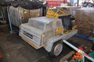 36 · 1 X PUTZMEISTER TRAILER MOUNTED CONCRETE PUMP, YELLOW, WITH GALVANISED PROTECTIVE CAGES, SOME MARKS, SURFACE RUST, WEAR CONSISTENT WITH USE, APPROX; 2M L X 1.5M W X 1.4M H
