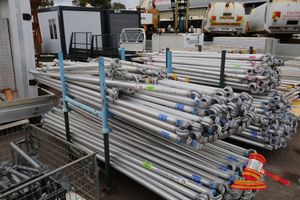 72 · APPROX; 10 X OUTRIGGER FEET APPROX; 1.5M L, APPROX; 44 X CUSTERS ALUMINIUM TUBES, APPROX; 2915MM LONG, SOME MARKS IN A METAL STILLAGE