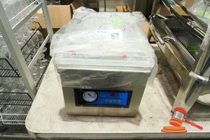 57 · VACUUM PACKING MACHINE (UNUSED)