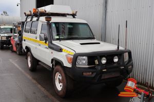 2011 Toyota Landcruiser Ambulance White, 4 x 4, Manual, Diesel Reg #: Unlicensed ODO: 102,232 Kms Showing on Clock Eng #: 1VD0135770 VIN: JTERV71J000005042 Features: Air Conditioning, Power Steering, Smartbar, Spotlights, GME Antenna, Snorkel, Sidesteps, Roof Racks, Worklights, 2x Spare Tyres, Bullbar, Towbar, External Power Plug - Male, Rollbar, Storage Cabinets, GME Handheld Radio, 1x Forward Facing Rear Seat, Side Access Door, Medical Stretcher. (Asset # LV5165), (*Key # 143, WP#4911*) Condit
