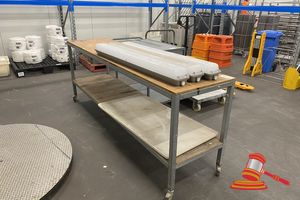 1 X Mobile Work Bench With Timber Top. Approx 600 X 2400 X H900mm. Multiple Drill Holes In Timber Top, 1 X Plastic Table With Fold Up Legs (600 X 1200mm), 3 X Enclosed Sealed Fluro Lights , Hardwired