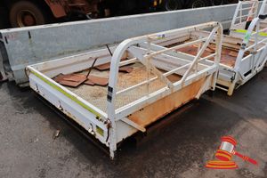 26 · METAL UTE TRAY, APPROX; 1.9M W X 1.8M L X 1.2M H, CONTAINS MUDFLAPS , SOME MARKS/RUST