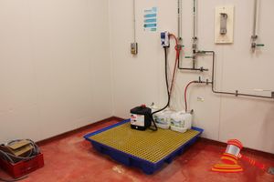 57 · PLASTIC BUND WITH GRATE, SEKO AUTOMATIC DETERGENT DISPENSER AND PART CONTAINERS OF ASSORTED DETERGENTS. APPROX 1300 X 1300 X H260MM