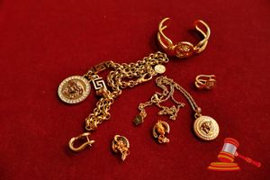 1 X 22CM YELLOW METAL NECKLACE MARKED VERSACE WITH 33MM YELLOW METAL PENDANT, 1 X 25CM YELLOW METAL NECKLACE MARKED VERSACE WITH 25MM PENDANT MARKED VERSACE, 1 X YELLOW METAL OPEN CUFF BANGLE WITH CENTRAL MEDALLION MARKED VERSACE , 2 X YELLOW METAL EARRINGS MARKED VERSACE, 2 X YELLOW METAL DROP EARRINGS MARKED VERSACE