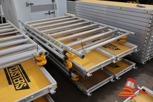 81 · 2 X ALUMINIUM FRAMED PLATFORMS, APPROX; 600MM W X 2.4M L X 60MM, 3 X METAL FRAME SIDES, APPROX; 1.3 M W X 2.9 M H, 1 X METAL FRAMED APPROX; 1.1 M H X 1.3 M W, SOME MARKS, ON A PALLET