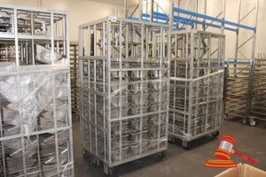 114 · EBERHURDT GMBH STAINLESS STEEL MOBILE MANUAL SPINDLE PRESS. APPROX 1010 X 870 X H1970MM. INCLUDES APPROX 21 X STAINLESS STEEL MOULD TRAYS (APPROX 300 X 820 X H200MM). INCLUDES SPINDLE PRESS HANDLE
