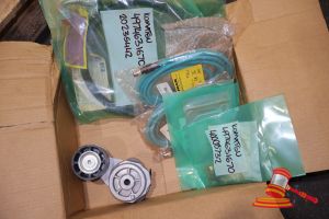 147 · ASSORTED PARTS, INCLUDES: KOMATSU BELT TENSIONER P/N; 40725289, KOMATSU GENUINE PARTS 427-N36-1120 ELEMENT KOMATSU HOSE 4974631670, VARIOUS OTHERS (POSS UNUSED, BOXED) (S44#4974631670/A, DR#1769)