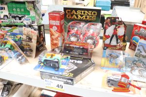 49 · BUNDLE OF TOYS INCLUDING: 1x CASINO GAMES, 1x JUMBLING TOWER GAME, 1x ABALONE GAME, 2x CENTY TRUCKS, ALL UNOPENED