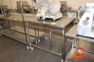 129 · STAINLESS STEEL MOBILE WORK BENCH WITH SPLASHBACK. APPROX 1150 X 900 X 1000MM