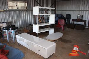 187 · 1 X WHITE GLOSS LAMINATE MULTI LEVEL DISPLAY UNIT. APPROX 1200 X 350 X H1700MM, 1 X MATCHING TV CABINET. APPROX 1800 X 450 X H500MM, 1 X MATCHING OVAL COFFEE TABLE. APPROX 1200 X 600 X H400MM. SOME MINOR DAMAGE
