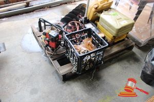 46 · 1 X HOMELITE POST HOLE DIGGER, MODEL: HBP940, (UNTESTED) 1 X FLOOR JACK, 1000 KG CAPACITY, (SOME MARKS) 3 X METAL JERRY CAN, YELLOW 1 X PLASTIC CRATE WITH ASSORTED CHAINS AND HARDWARE JUMPER LEADS