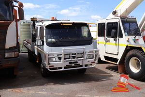 14 · 2011 Mitsubishi Canter 7/800 Crew Cab Flat Bed Truck White, 4 x 2, Manual, Diesel Reg #: Unlicensed ODO: 121,452 Kms Showing on Clock Eng #: 4M50D5705, VIN: JLFFE85DG0KJ10320 Features: Air Conditioning, Power Steering, Spotlights, Bullbar, Pintle Tow Hitch. (S44#RITM0594113), (Disp# 67155), (Asset # 04H3578) (*Key # 68, WP# 4969*) Condition: **Isolator Switch Damaged.** Panel: FAIR, Paint: FAIR, Glass: FAIR, Tyres: FAIR, Dash: FAIR, Upholstery: FAIR, Floor: FAIR, Overall Condition: FAIR