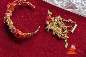 1 X YELLOW METAL BANGLE MARKED LES NEREIDIS (SMALL) WITH ENAMEL EXOTIC ORCHIDS AND MULTICOLOURED STONES, 1 X YELLOW METAL NECKLACE MARKED LES NEREIDIS WITH ENAMEL RED SNOW LOTUS WITH 6 X CLEAR AND 1 X YELLOW STONES, 2 X YELLOW METAL DROP EARRINGS MARKED LES NEREIDIDS WITH ENAMEL STRAWBERRY WITH 2 X RED STONES, 4 X CLEAR STONES AND 4 X SMALL PEARLS
