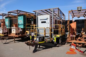 57 · 2018 GENERATING POWER PLANT GMC DEWATERING TRAILER, WHITE/ORANGE, TANDEM, DIESEL, REG# UNLIC,, VIN# NOT SIGHTED, RING HITCH, SOLAR PANELS, SECTION OF PIPING & VALVES, PRO POWER GENERATOR - MODEL# LC200C, S/N: LC200C-MO1-17-00006, PRIME KVA 200, 415 V, YOM: 2018, WALKING PLATFORM ON BOTH SIDES OF UNIT, (CONTROL PANEL LOOSE, MUD/DIRT RESIDUE INSIDE CONTROL PANEL & INSIDE GENERATOR, LOCKOUT PADLOCK ON ISOLATOR)
