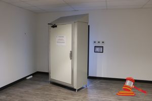 209 · METAL DUAL ACCESS STORAGE UNIT WITH 1 X ROLLER DOOR, 1 X NORMAL ACCESS DOOR AND REMOVABLE SLOPED METAL TOP SECTION. GREY. USED FOR STORAGE OF FOOD PRODUCTION CLOTHING. APPROX 1200 X 600 X H2100MM