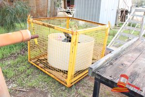 23 · STEEL LIFTING BASKET WITH SWING OUT DOOR AND CONTENTS. YELLOW. WWL 1000KG. APPROX 1300 X 1300 X H1100MM