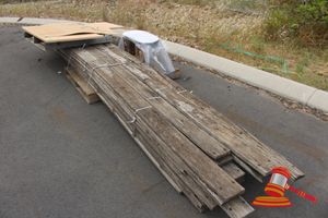 Pallet containing Approx 36 x Timber Palings, Various Lengths, Average 4000/4200mm x 145mm x 30mm; 2 x Timber Blocks, Approx 400mm x 300mm Diam; 1 x L-Shaped Timber Laminate Office Desk Top, Approx 1800mm x 1800mm