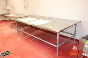 62 · HD STAINLESS STEEL WORK/PROCESSING TABLE WITH LUGS FOR CUTTING BOARDS. APPROX 2990 X 1500 X H930MM. INCLUDES 2 X CUTTING BOARDS