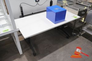 23 · BLUE METAL LOCKABLE BOX WITH KEYS, 2 X WHITE TABLE WITH BLACK LEGS, TABLE TOP FLIPS TO EITHER SIDE (SOME MARKS), APPROX 800 x 1500mm