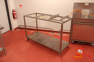 41 · STAINLESS STEEL 2 TIER MOBILE WORK BENCH WITH PERFORATED SECTION ON TOP SHELF AND PERFORATED BOTTOM SHELF. APPROX 1500 X 660 X H990MM