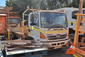 9 · 2008 Hino 500, 1227 G01J Series 2 Cab Tray Back White, 4x2, Manual, Diesel Reg #: Unlicensed ODO: Approx 43,061 Kms Showing on Clock VIN: JHDG08JLKXXX10062 Features: Air Conditioning, Power Steering, Storage Container On Side Of Vehicle, Air Compressor, Tray Light Container Pins & Beacon Light, Fire Extinguisher. (Asset # ST06), (Disp# 03.08.2026-16:15:16), (*Key # 141, WP # 4762*) Condition: ** Rust Across Vehicle, Rust On Front Of Vehicle, Holes In Tray.** Panel: POOR, Paint: FAIR, Glass: FAIR
