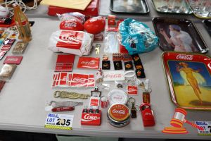 285 · BUNDLE OF ASSORTED COCA-COLA ITEMS INCLUDING: STICKERS, MAGNETS, PIN, BALLS ETC