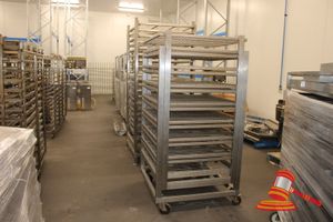 111 · STAINLESS STEEL MOBILE 8 TIER SPINDLE PRESS. APPROX 1000 X 1000 X H1950MM. SPINDLE PRESS HANDLE MISSING. WORKING CONDITION OF PRESS UNKNOWN